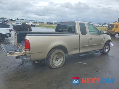 Trzecie zdjęcie samochodu z tyłu: 1999 FORD F150 VIN:1FTRX17L5XKB75254 - miniatura
