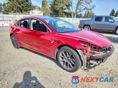 Czwarte zdjęcie samochodu z boku: 2020 TESLA MODEL 3 VIN:5YJ3E1EB0LF803038 - miniatura