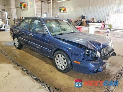 Czwarte zdjęcie samochodu z boku: 2003 KIA OPTIMA LX VIN:KNAGD126X35214492 - miniatura