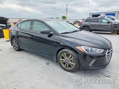Czwarte zdjęcie samochodu z boku: 2018 HYUNDAI ELANTRA VALUE EDITION VIN:5NPD84LF4JH301067 - miniatura
