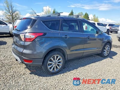 Trzecie zdjęcie samochodu z tyłu: 2017 FORD ESCAPE TITANIUM VIN:1FMCU9JD7HUD77500 - miniatura