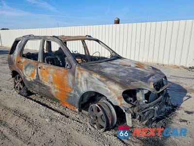 Czwarte zdjęcie samochodu z boku: 2003 MERCEDES-BENZ ML 500 VIN:4JGAB75E73A430470 - miniatura