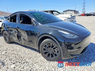 Czwarte zdjęcie samochodu z boku: 2022 TESLA MODEL Y VIN:7SAYGAEE7NF576527 - miniatura