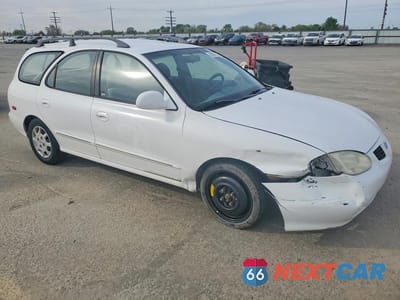 Czwarte zdjęcie samochodu z boku: 2000 HYUNDAI ELANTRA GLS VIN:KMHJW35F8YU161844 - miniatura
