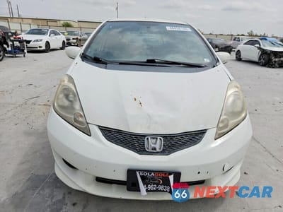 Piąte zdjęcie samochodu w środku: 2009 HONDA FIT SPORT VIN:JHMGE88659S040114 - miniatura