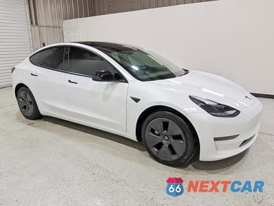 Czwarte zdjęcie samochodu z boku: 2021 TESLA MODEL 3 VIN:5YJ3E1EA6MF099565 - miniatura