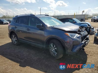 Czwarte zdjęcie samochodu z boku: 2018 TOYOTA RAV4 LE VIN:JTMBFREV8JJ730976 - miniatura