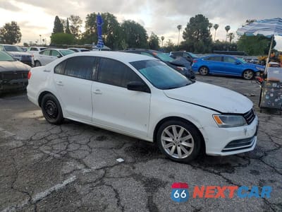 Czwarte zdjęcie samochodu z boku: 2016 VOLKSWAGEN JETTA S VIN:3VW267AJ2GM221384 - miniatura