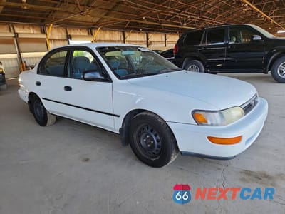 Czwarte zdjęcie samochodu z boku: 1995 TOYOTA COROLLA DX VIN:1NXAE09B0SZ312417 - miniatura