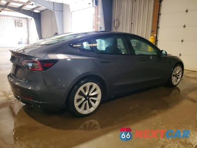 Trzecie zdjęcie samochodu z tyłu: 2023 TESLA MODEL 3 VIN:5YJ3E1EA6PF449166 - miniatura