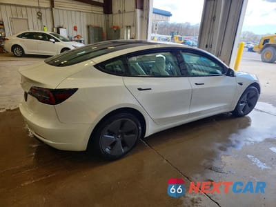 Trzecie zdjęcie samochodu z tyłu: 2023 TESLA MODEL 3 VIN:5YJ3E1EA3PF573119 - miniatura