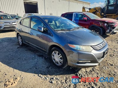 Czwarte zdjęcie samochodu z boku: 2010 HONDA INSIGHT LX VIN:JHMZE2H58AS011174 - miniatura