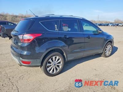 Trzecie zdjęcie samochodu z tyłu: 2017 FORD ESCAPE TITANIUM VIN:1FMCU9JD6HUD56539 - miniatura