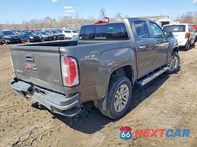 Trzecie zdjęcie samochodu z tyłu: 2016 GMC CANYON SLT VIN:1GTG6DE38G1261243 - miniatura