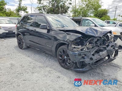 Czwarte zdjęcie samochodu z boku: 2014 BMW X5 SDRIVE35I VIN:5UXKR2C59E0H31634 - miniatura