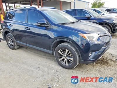 Czwarte zdjęcie samochodu z boku: 2018 TOYOTA RAV4 XLE VIN:JTMWFREV5JJ195848 - miniatura