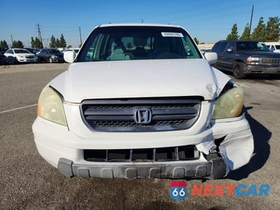 Piąte zdjęcie samochodu w środku: 2003 HONDA PILOT EX VIN:2HKYF18403H591582 - miniatura