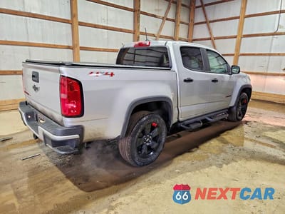 Trzecie zdjęcie samochodu z tyłu: 2018 CHEVROLET COLORADO LT VIN:1GCGTCEN9J1106776 - miniatura