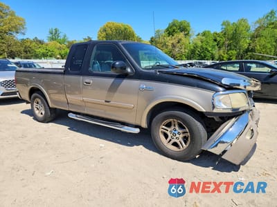 Czwarte zdjęcie samochodu z boku: 2003 FORD F-150 VIN:1FTRX17W13NB34011 - miniatura