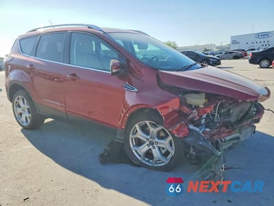 Czwarte zdjęcie samochodu z boku: 2018 FORD ESCAPE TITANIUM VIN:1FMCU9J99JUC70031 - miniatura
