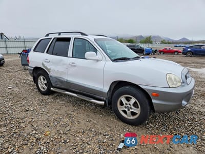 Czwarte zdjęcie samochodu z boku: 2002 HYUNDAI SANTA FE GLS VIN:KM8SC13D82U287535 - miniatura