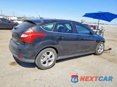Trzecie zdjęcie samochodu z tyłu: 2014 FORD FOCUS TITANIUM VIN:1FADP3N26EL264506 - miniatura