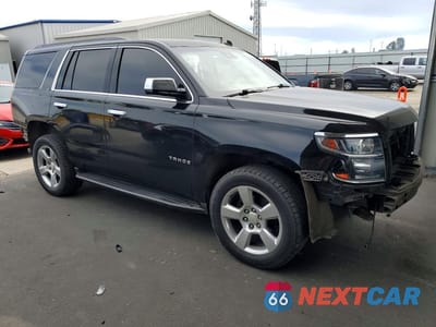 Czwarte zdjęcie samochodu z boku: 2015 CHEVROLET TAHOE C1500 LT VIN:1GNSCBKC1FR232797 - miniatura