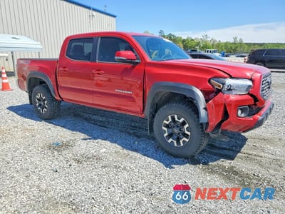 Czwarte zdjęcie samochodu z boku: 2023 TOYOTA TACOMA TRD OFF-ROAD VIN:3TMCZ5AN1PM587326 - miniatura