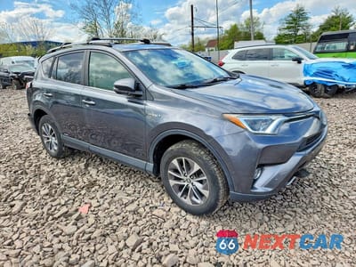 Czwarte zdjęcie samochodu z boku: 2018 TOYOTA RAV4 HYBRID XLE VIN:JTMRJREV1JD157706 - miniatura