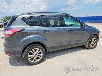 Trzecie zdjęcie samochodu z tyłu: 2018 FORD ESCAPE SE VIN:1FMCU0GD6JUC10778 - miniatura