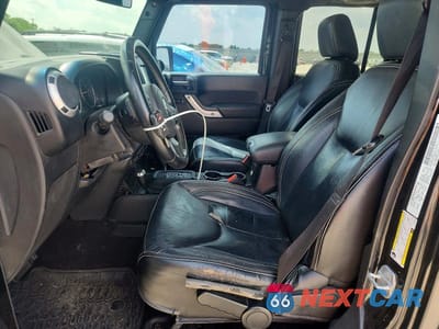 Zdjęcie 7 z 12 samochodu: 2014 JEEP WRANGLER UNLIMITED SAHARA VIN:1C4BJWEG9EL100473 - miniatura