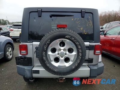 Zdjęcie 6 z 11 samochodu: 2013 JEEP WRANGLER UNLIMITED SAHARA VIN:1C4HJWEG8DL571605 - miniatura