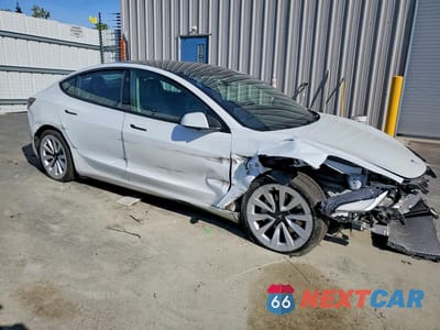 Czwarte zdjęcie samochodu z boku: 2022 TESLA MODEL 3 VIN:5YJ3E1EB0NF158491 - miniatura