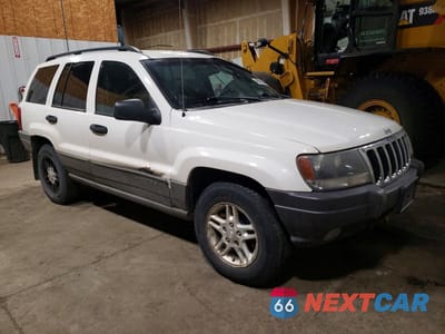 Czwarte zdjęcie samochodu z boku: 2002 JEEP GRAND CHEROKEE LAREDO VIN:1J4GW48N02C278400 - miniatura