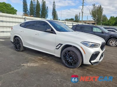 Czwarte zdjęcie samochodu z boku: 2020 BMW X6 M VIN:5YMCY0C09L9B05681 - miniatura