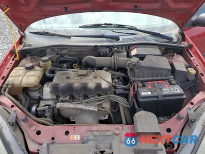 Zdjęcie 11 z 13 samochodu: 2004 FORD FOCUS LX VIN:1FAFP33P14W132192 - miniatura