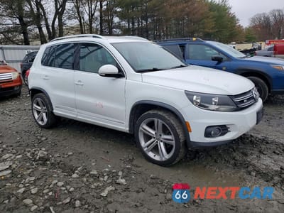 Czwarte zdjęcie samochodu z boku: 2016 VOLKSWAGEN TIGUAN S VIN:WVGBV7AX8GW091360 - miniatura