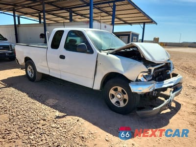 Czwarte zdjęcie samochodu z boku: 2001 FORD F150 VIN:1FTRX17W01NA87728 - miniatura