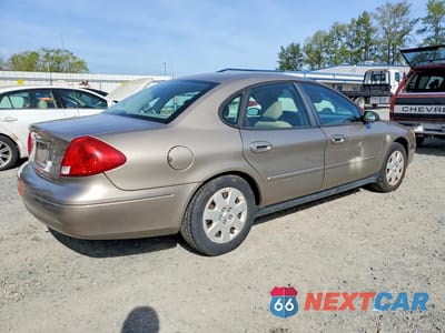 Trzecie zdjęcie samochodu z tyłu: 2002 FORD TAURUS LX VIN:1FAFP52202G210602 - miniatura