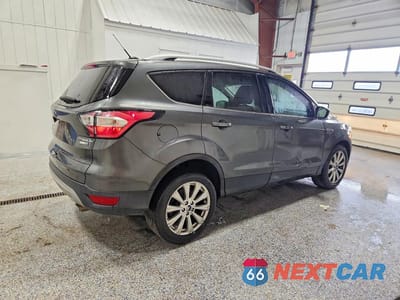 Trzecie zdjęcie samochodu z tyłu: 2017 FORD ESCAPE TITANIUM VIN:1FMCU9J9XHUC57797 - miniatura