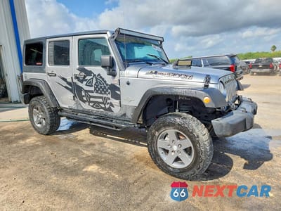 Czwarte zdjęcie samochodu z boku: 2013 JEEP WRANGLER UNLIMITED SPORT VIN:1C4BJWDG4DL628857 - miniatura