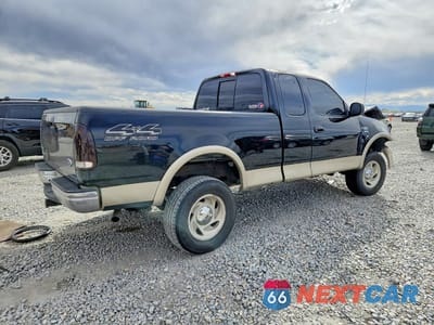 Trzecie zdjęcie samochodu z tyłu: 2000 FORD F150 VIN:1FTRX18L5YKA03421 - miniatura