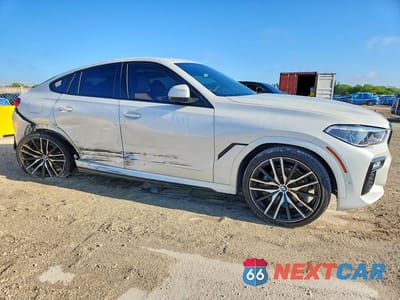 Czwarte zdjęcie samochodu z boku: 2021 BMW X6 SDRIVE 40I VIN:5UXCY4C05M9G14201 - miniatura