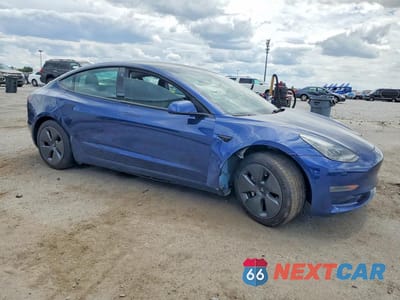 Czwarte zdjęcie samochodu z boku: 2023 TESLA MODEL 3 VIN:5YJ3E1EA8PF457690 - miniatura