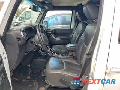 Zdjęcie 7 z 11 samochodu: 2017 JEEP WRANGLER UNLIMITED SAHARA VIN:1C4BJWEG3HL582040 - miniatura