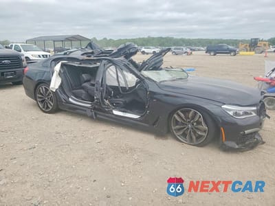 Czwarte zdjęcie samochodu z boku: 2019 BMW M760 XI VIN:WBA7H6C5XKG615048 - miniatura