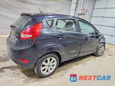 Trzecie zdjęcie samochodu z tyłu: 2012 FORD FIESTA SE VIN:3FADP4EJ8CM175495 - miniatura
