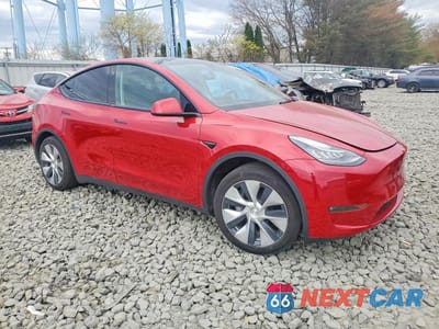 Czwarte zdjęcie samochodu z boku: 2023 TESLA MODEL Y VIN:7SAYGAEE4PF615660 - miniatura