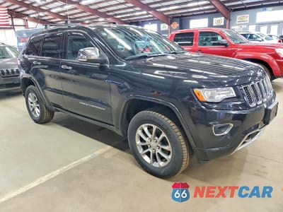 Czwarte zdjęcie samochodu z boku: 2015 JEEP GRAND CHEROKEE OVERLAND VIN:1C4RJFCG8FC620067 - miniatura