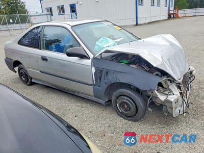 Czwarte zdjęcie samochodu z boku: 1999 HONDA CIVIC HX VIN:1HGEJ7123XL030695 - miniatura